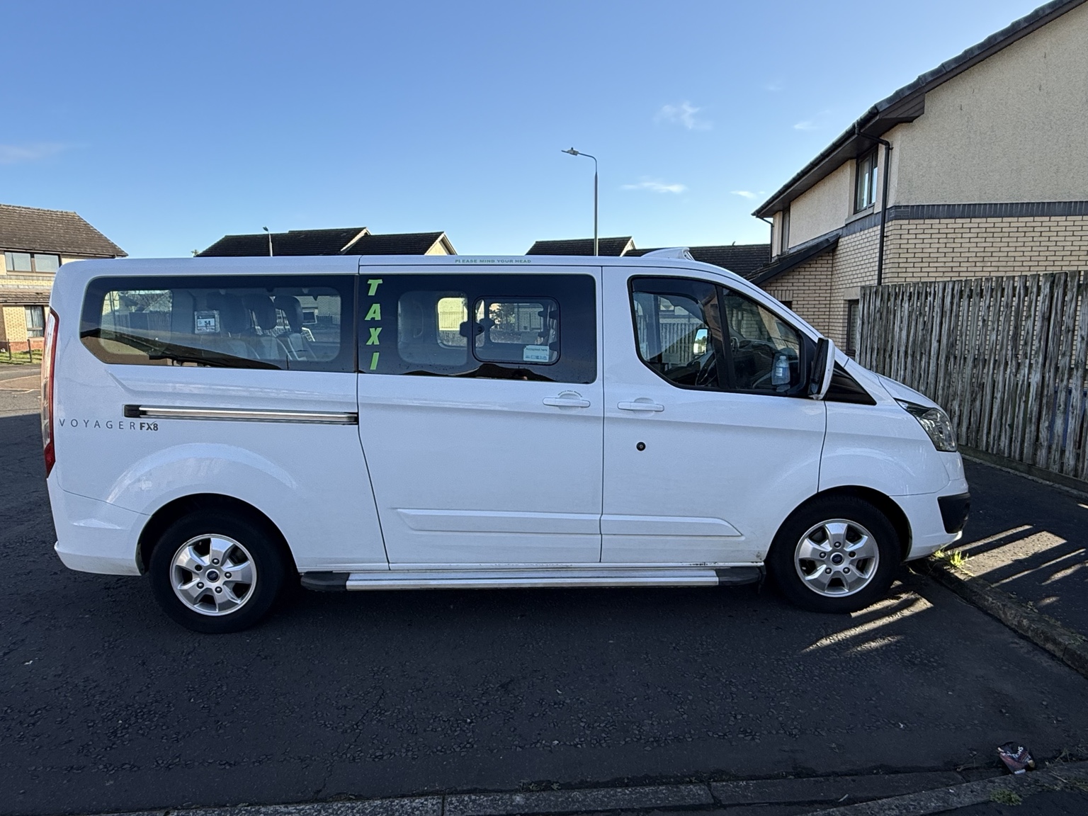 Side view of the ASO Travel white 8-seater